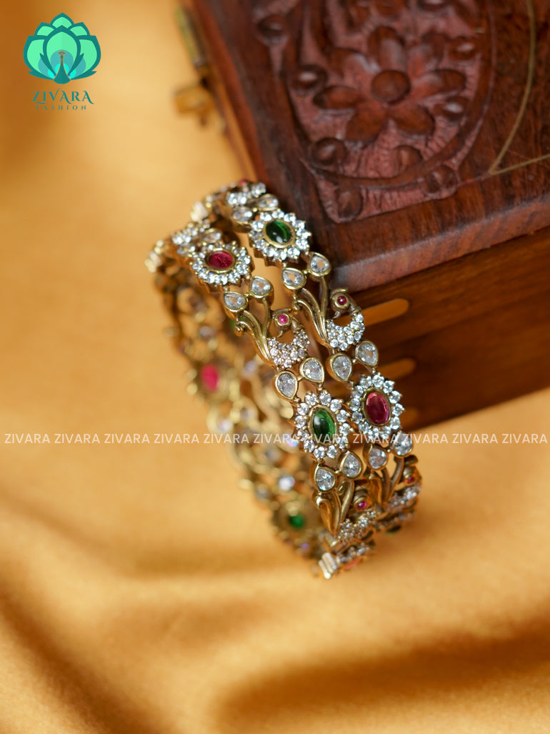 PEACOCK AND OVAL STONE -Premium VICTORIA DARK  finish bangles- latest jewellery collection- Zivara Fashion