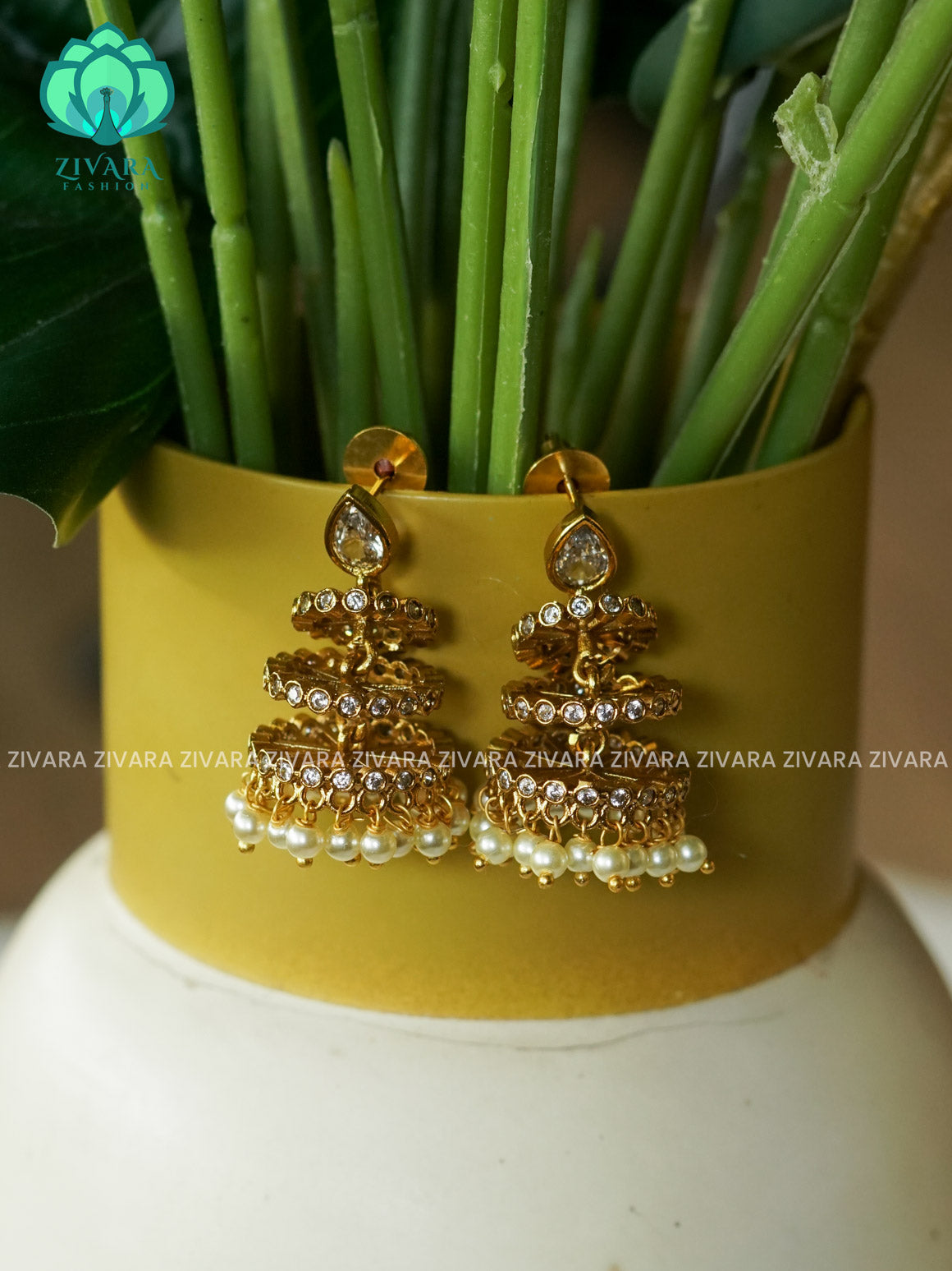 DIYA- WHITE STONE TRIPLE LAYER JHUMKAS - TRADITIONAL PREMIUM MATTE  polish JHUMKA- latest jewellery collection- zivara fashion