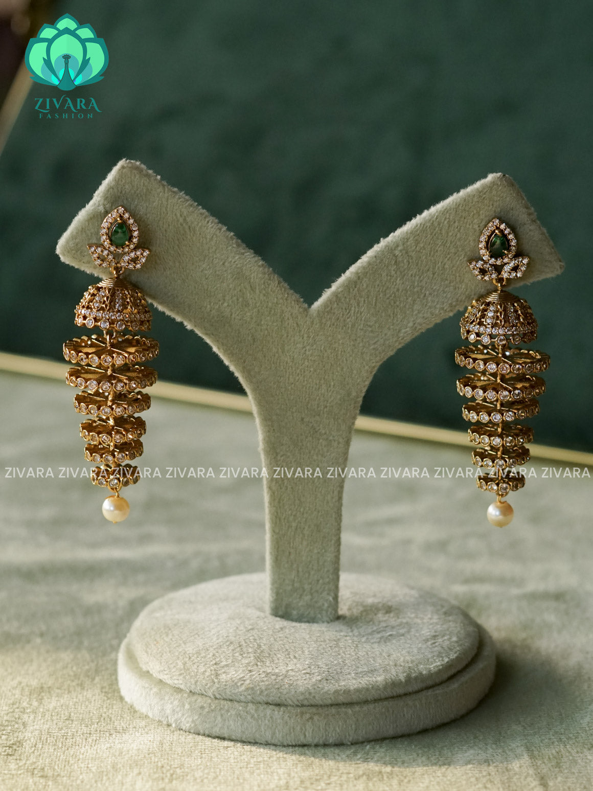 DIYA - GREEN TEAR SIX LAYER  WHITE STONE JHUMKA - TRADITIONAL PREMIUM MATTE  polish JHUMKA- latest jewellery collection- zivara fashion