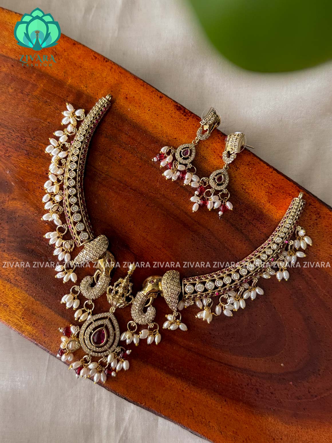 RUBY TEMPLE - SUBTLE GOLD finish horn PREMIUM neckwear with earrings  -  latest pocket friendly south indian jewellery collection