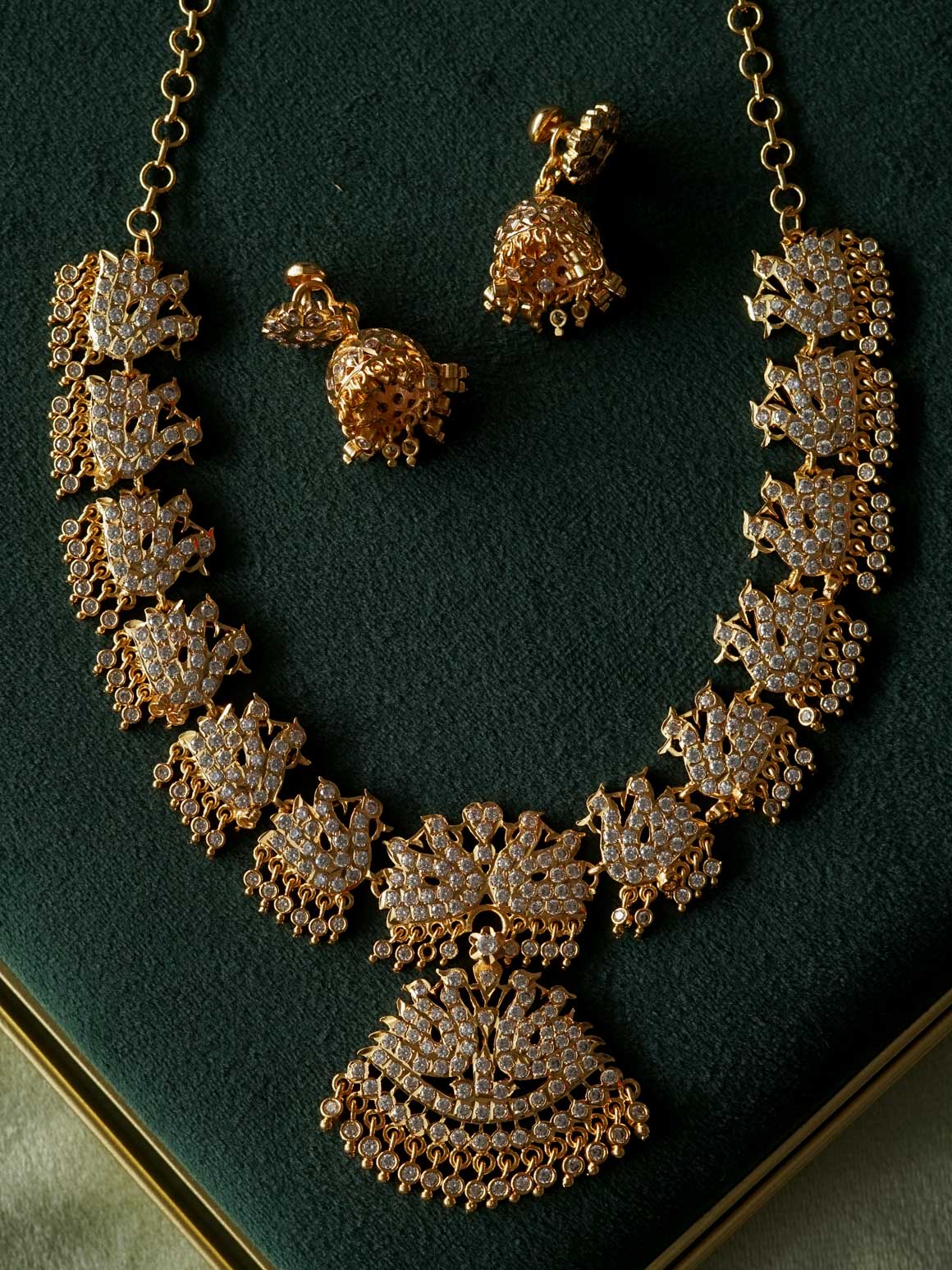 AMBIGAI-WHITE STONE PEACOCK MOTIF MICROGOLD POLISH ATTIGAI WITH EARRING - Zivara Fashion- latest jewellery desigN