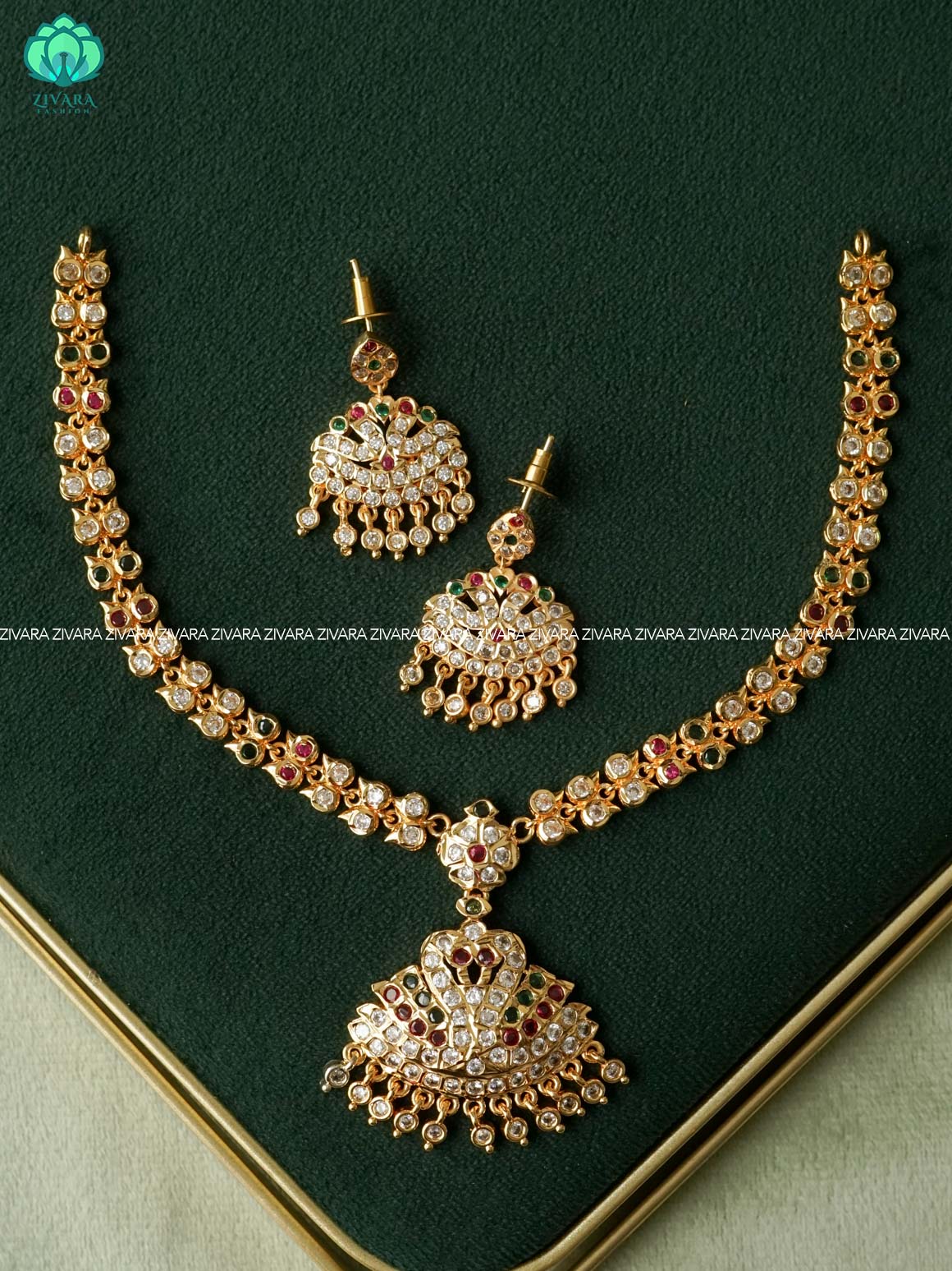 AMBIGAI- RUBY AND GREEN STONE PEACOCK MOTIF MICROGOLD POLISH ATTIGAI WITH EARRINGS - Zivara Fashion- latest jewellery design