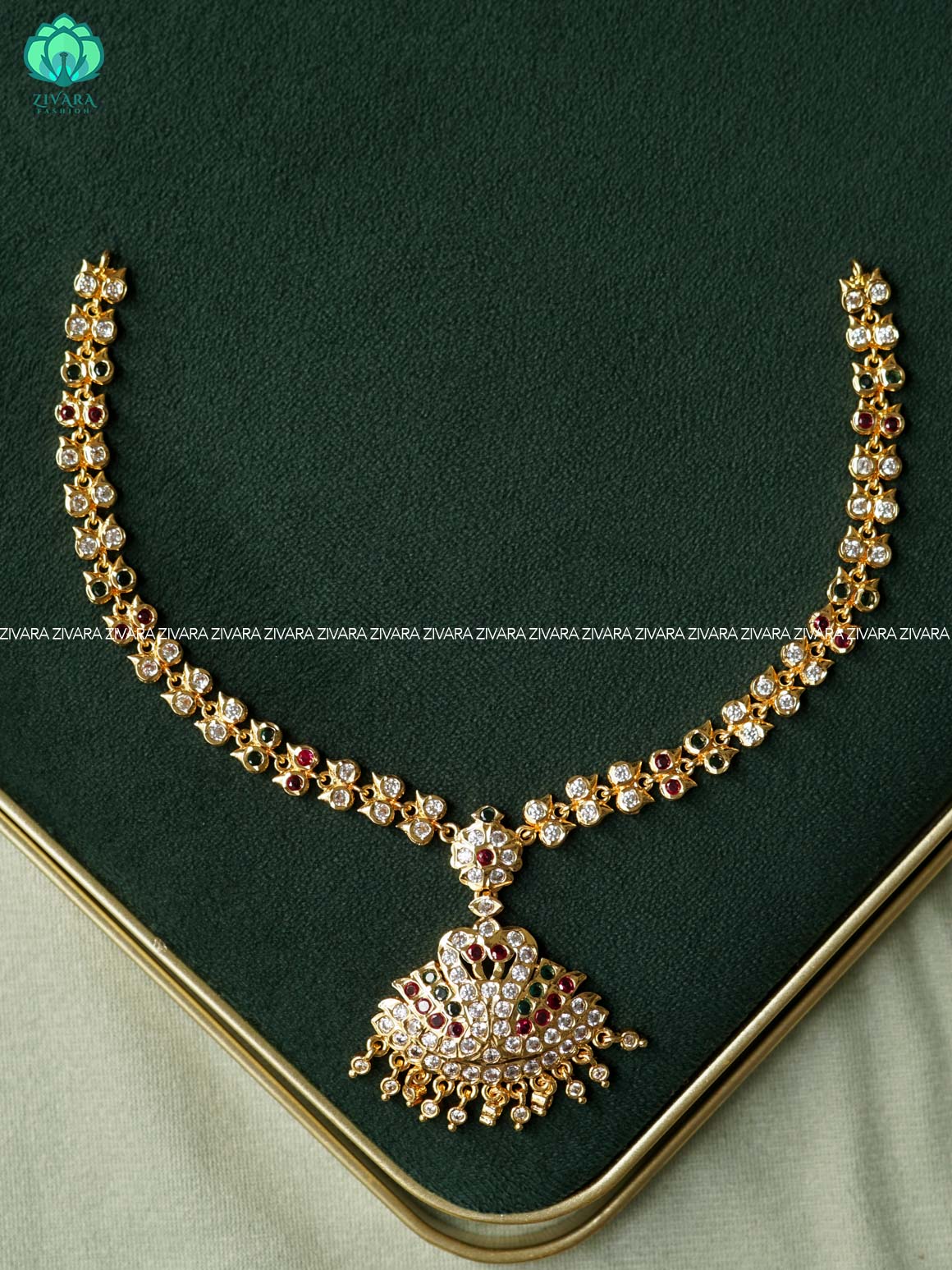 AMBIGAI- RUBY AND GREEN PEACOCK MOTIF MICROGOLD POLISH ATTIGAI  - Zivara Fashion- latest jewellery design