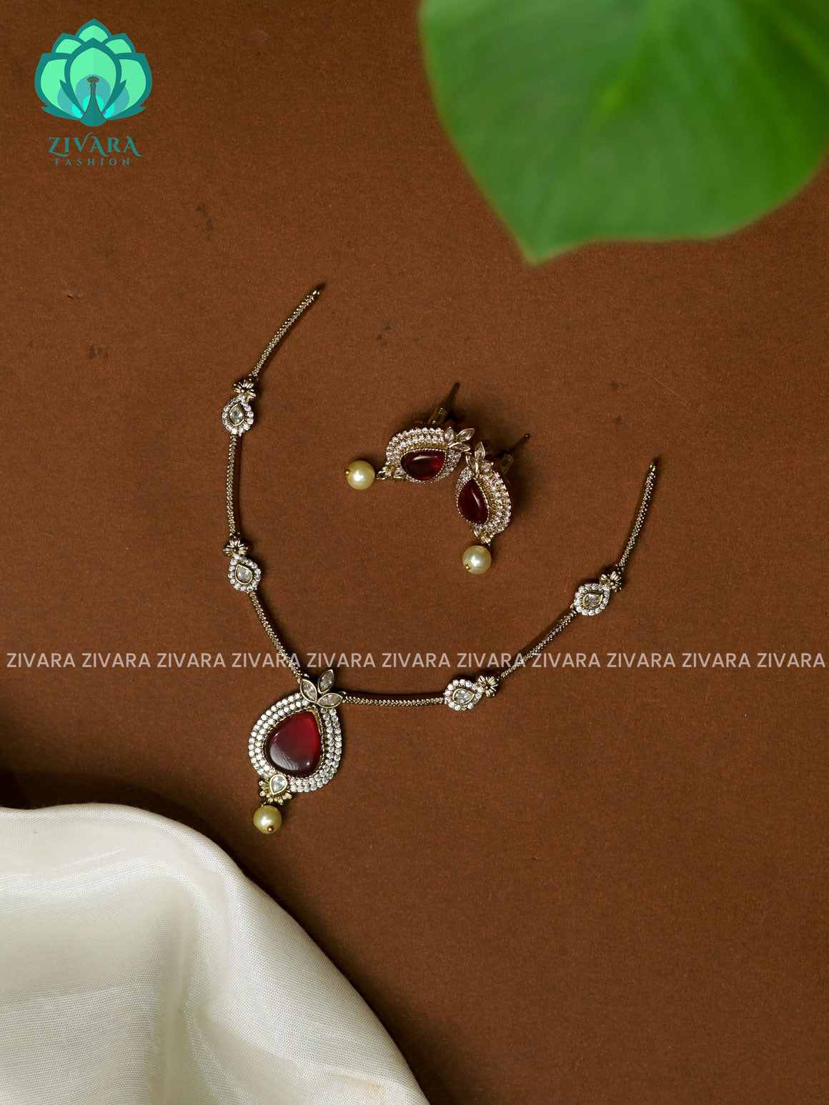 RUBY SIMPLE SUBTLE GOLD FINISH TEAR PENDANT   - stylish and minimal elegant neckwear with earrings- Zivara FashioN