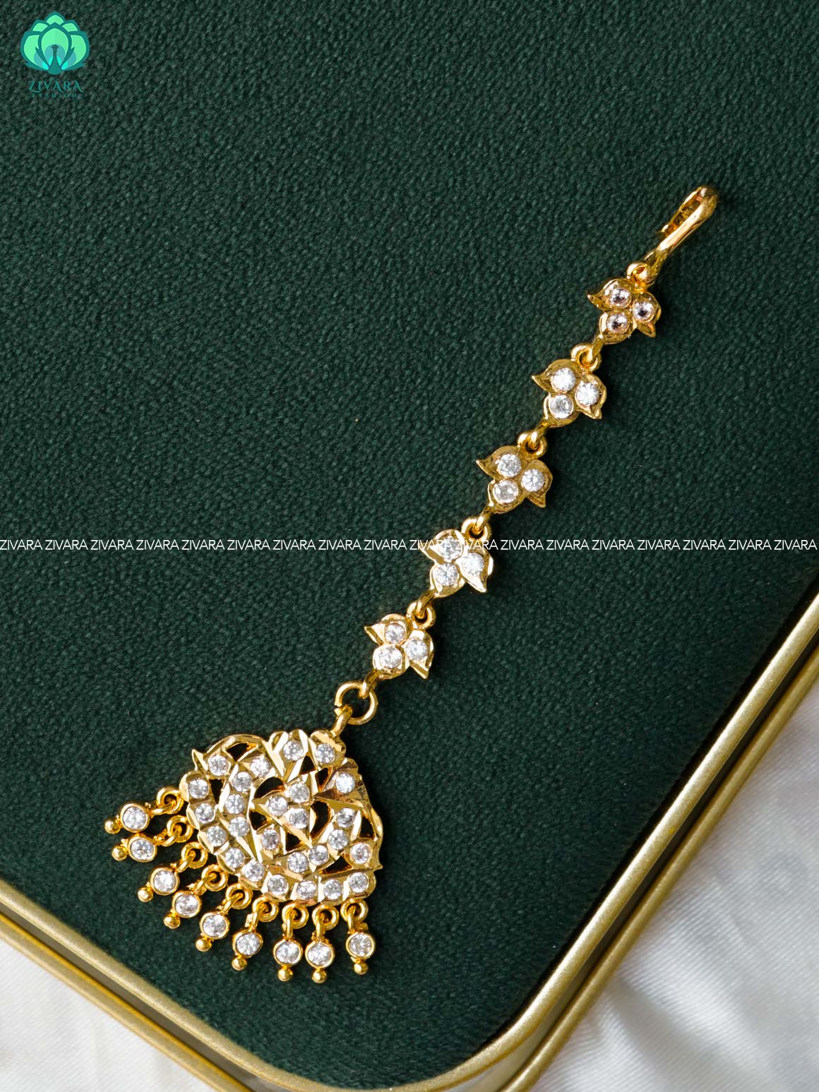 AMBIGAI- WHITE STONE TIKKA/CHUTTI MICROGOLD POLISH bridal head accessory- latest bridal collection - Zivara fashion