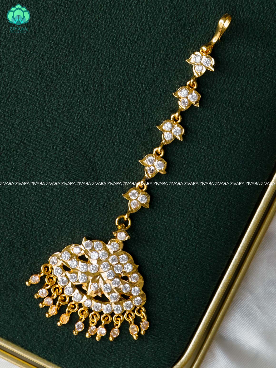 AMBIGAI- WHITE STONE TIKKA/CHUTTI MICROGOLD POLISH bridal head accessory- latest bridal collection - Zivara fashion