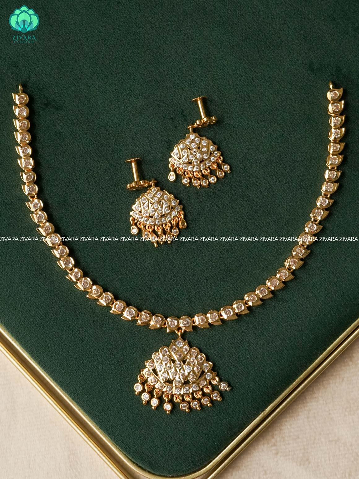 AMBIGAI-  WHITE STONE MANGO MOTIF MICROGOLD POLISH ATTIGAI WITH EARRINGS- Zivara Fashion- latest jewellery design