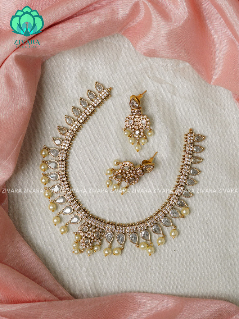 Scintillating white stone -Traditional south indian premium neckwear with earrings- Zivara Fashion- latest jewellery design.