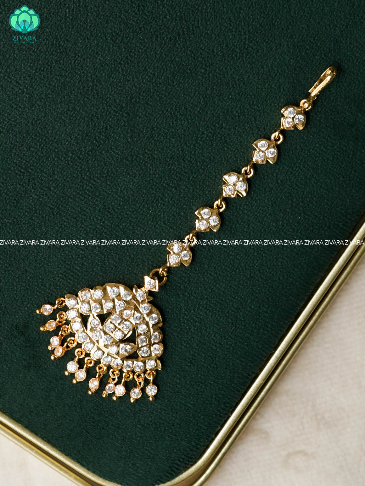 AMBIGAI- WHITE STONE TIKKA/CHUTTI MICROGOLD POLISH bridal head accessory- latest bridal collection - Zivara fashion
