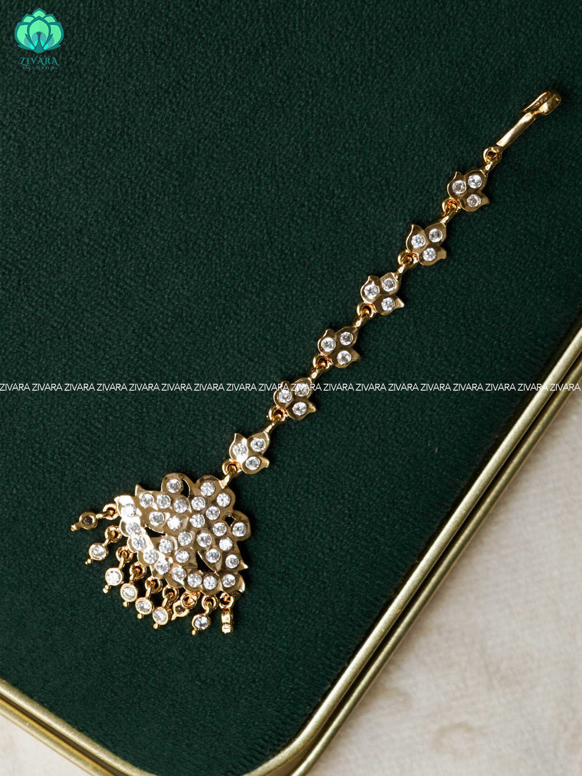 AMBIGAI- WHITE STONE TIKKA/CHUTTI MICROGOLD POLISH bridal head accessory- latest bridal collection - Zivara fashion