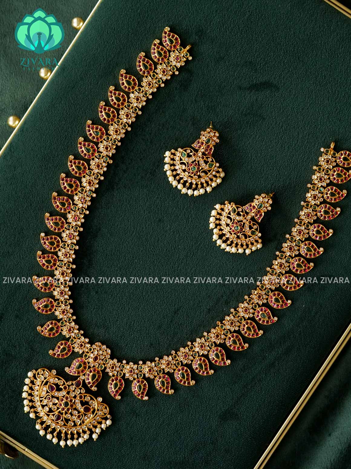 RUBY GREEN WHITE STONE MANGO WITH PEACOCK MOTIF PENDANT  - Traditional PREMIUM MATTE polish MIDCHEST haaram/neckwear with earrings- Zivara Fashion