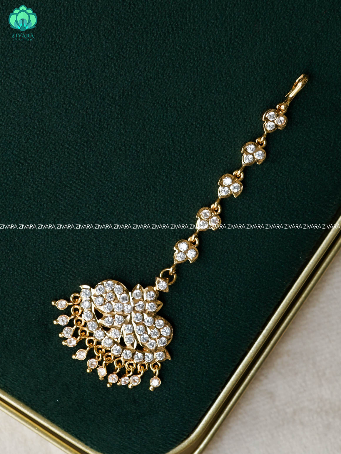 AMBIGAI- WHITE STONE TIKKA/CHUTTI MICROGOLD POLISH bridal head accessory- latest bridal collection - Zivara fashion