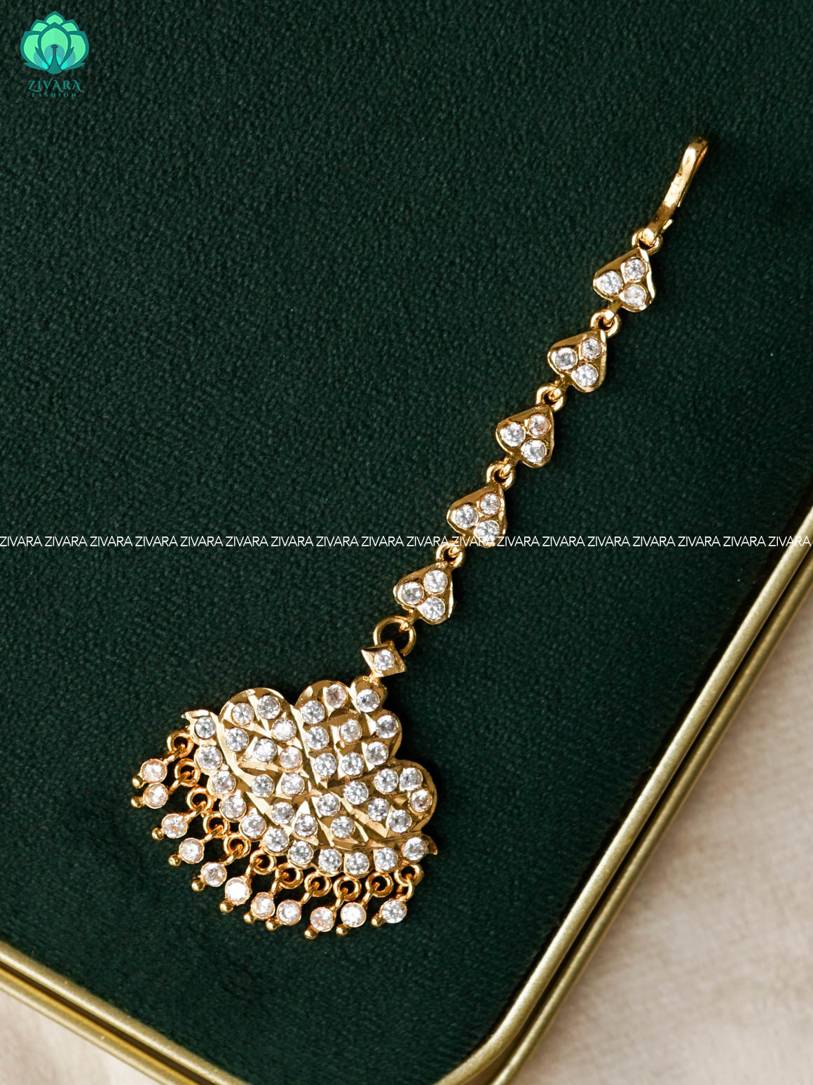 AMBIGAI- WHITE STONE TIKKA/CHUTTI MICROGOLD POLISH bridal head accessory- latest bridal collection - Zivara fashion