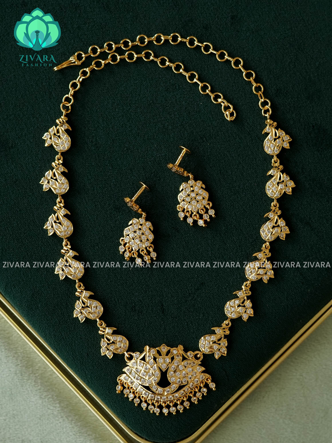 AMBIGAI- WHITE AND RUBY STONE MANGA MOTIF MICROGOLD POLISH ATTIGAI - Zivara Fashion- latest jewellery design