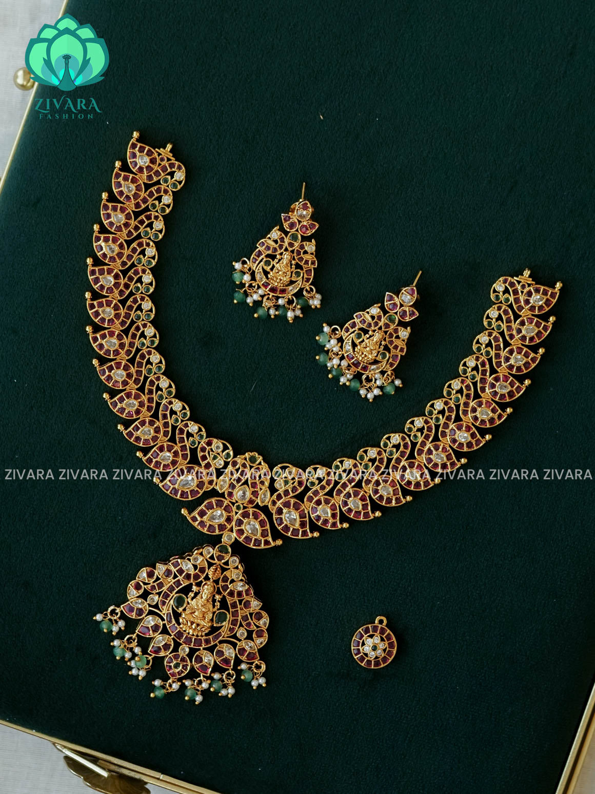 RUBY GREEN WHITE STONE MANGO WITH PEACOCK MOTIF PENDANT  - Traditional PREMIUM MATTE polish MIDCHEST haaram/neckwear with earrings- Zivara Fashion